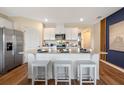 Bright kitchen with stainless steel appliances, white cabinets, and a spacious island at 3178 Partington Blvd, Davenport, FL 33837