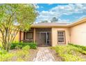 Inviting front porch and landscaping welcome you to this charming home at 321 Davinci Pass, Kissimmee, FL 34759