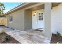 Inviting front entrance with brick accents and a tiled walkway leading to the front door at 1300 Montego Ln, Orlando, FL 32807