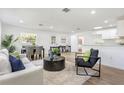 Bright, open-concept living room with modern furnishings, wood floors, and plenty of natural light at 1300 Montego Ln, Orlando, FL 32807
