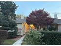 Exterior view of home showcasing mature trees and landscaping around the property at 1400 Tedford St, Eustis, FL 32726