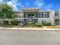 Inviting multi-Gathering residence featuring staircases, large windows, and well-maintained landscaping at 151 N Orlando Ave # 229, Winter Park, FL 32789