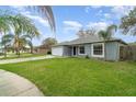 Charming single-story home featuring a well-manicured lawn, a one car garage, and a welcoming entrance at 1967 Villa Angelo Blvd, St Cloud, FL 34769
