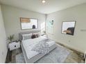 Bright bedroom with a neutral color palette, featuring a large bed and stylish wall art at 2209 Sw 178Th St, Ocala, FL 34473