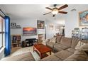 Spacious living room featuring a ceiling fan, and an entertainment center at 7730 Pineapple Dr, Orlando, FL 32835