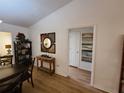 View of the dining room and hallway, showcasing the home's layout and natural light at 1380 Red Ash Pl, The Villages, FL 32162