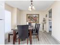 Dining area with modern flooring, chandelier, and stylish decor at 5042 Downing St # 5, Orlando, FL 32839