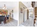 Inviting dining area with modern flooring, chandelier, and stylish decor at 5042 Downing St # 5, Orlando, FL 32839