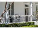 Inviting front porch with seating area, a perfect spot to relax and enjoy the neighborhood at 5189 Fenwood Ln, Orlando, FL 32814