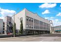 Contemporary building showcasing architectural design, large windows, and street view at 62 W Colonial Dr # 301, Orlando, FL 32801