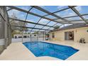 Covered screened pool and patio area has ample seating and room for entertaining friends and Gathering at 760 Mentmore Cir, Deltona, FL 32738