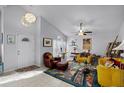 Bright living room with vaulted ceilings, tile floors, and colorful furnishings at 10809 Oak Glen Cir, Orlando, FL 32817