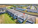 An aerial view of the back of the home highlighting the screen-enclosed patio at 2004 Summer Dr, Davenport, FL 33897