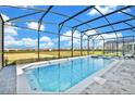 Beautiful screened-in pool and spa with plenty of space to relax and enjoy the outdoors at 2004 Summer Dr, Davenport, FL 33897