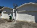 Two-car garage doors provide convenient access and ample parking at the residence at 218 Perth Ct # A, Winter Springs, FL 32708