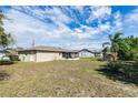 Expansive backyard with a screened porch, offering plenty of space for outdoor activities at 759 Swallow St, Deltona, FL 32725