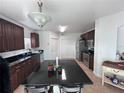 Spacious kitchen featuring a large island, stainless steel appliances, and plenty of cabinet space at 14218 Squirrel Run, Orlando, FL 32828