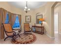 Inviting interior with tile floors, decorative rugs, neutral walls, with ample seating at 1562 Travertine Ter, Sanford, FL 32771