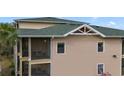 Exterior view of condo featuring screened balconies, offering residents a private outdoor space at 3050 Pirates Retreat Ct # 402, Kissimmee, FL 34747