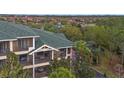 The screened balconies on multiple levels provide private outdoor spaces with lovely treetop scenery at 3050 Pirates Retreat Ct # 402, Kissimmee, FL 34747
