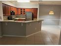 Well-lit kitchen with stainless steel appliances, granite counters, and plenty of cabinet storage at 3561 Conroy Rd # 214, Orlando, FL 32839