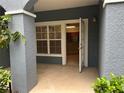Private patio leading to an open kitchen with stone counters at 3561 Conroy Rd # 214, Orlando, FL 32839