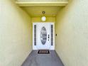 Inviting front entrance with a decorative glass door and neutral siding at 458 Hollinghead Loop, Davenport, FL 33896