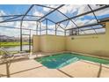 Screened-in private pool with lounge chair and views of a serene pond at 4841 Romeo Cir, Kissimmee, FL 34746
