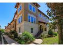 Elegant multi-story home with beautiful architectural details and lush landscaping at 528 Lobelia Dr, Lake Mary, FL 32746