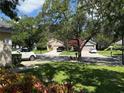 Picturesque street view showcasing well-kept homes with mature trees and manicured lawns at 536 Dunoon St, Ocoee, FL 34761