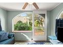 Inviting porch area featuring an archway and view of the lush greenery outside at 7 Clarendon Ct, Daytona Beach, FL 32118