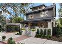 Charming two-story home with landscaped yard and a welcoming front porch at 718 E Livingston St, Orlando, FL 32803