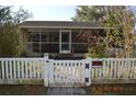 House behind white picket fence with a No Trespassing sign at 933 Lakehurst St, Lakeland, FL 33805
