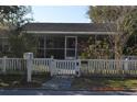 Close up of house behind white picket fence with a No Trespassing sign at 933 Lakehurst St, Lakeland, FL 33805