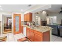 Well-equipped kitchen featuring granite counters, mosaic backsplash, and a pantry at 1113 Lyric Dr, Deltona, FL 32738