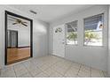 Inviting entryway featuring tile floors, natural light from multiple windows, and a clear view to the home's interior at 303 S Forest Ave, Orlando, FL 32803