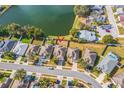 An aerial view shows the home's location on a well maintained street with a pond view at 3722 Madbury Cir, Lakeland, FL 33810