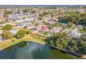 An aerial view shows the home's location on a well maintained street with a pond view at 3722 Madbury Cir, Lakeland, FL 33810