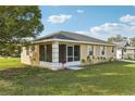 Charming single-story home featuring a screened in porch and well-maintained lawn at 4431 Clubhouse Rd, Lakeland, FL 33812