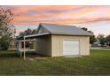 Detached garage with covered parking on a grassy lot at 4431 Clubhouse Rd, Lakeland, FL 33812