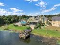 Exterior view of a condo featuring a beautiful waterfront location, patio, and community pool at 942 Lake Destiny Rd # B, Altamonte Springs, FL 32714