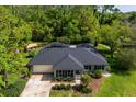 Aerial shot of a home featuring a screened pool, well-maintained landscaping, and a spacious backyard at 113 Wheatland Ct, Longwood, FL 32779