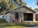 Charming single-story home featuring an inviting covered porch and tidy landscaping at 1352 Sw 69Th Rd, Bushnell, FL 33513