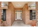 Covered front porch with brick columns, providing a welcoming entrance to the home at 1600 Amboy Dr, Deltona, FL 32738