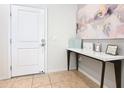 Entryway with white door and console table with tasteful decor on tile flooring at 4594 Terrasonesta Dr, Davenport, FL 33837