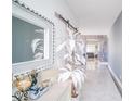 Bright foyer with neutral paint, tile floor, modern decor, and sliding barn doors at 523 Cascading Creek Ln, Winter Garden, FL 34787
