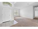 Inviting foyer showcases tile flooring, a bright window, and seamless access to the spacious living area at 536 Kilimanjaro Dr, Kissimmee, FL 34758