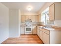 Functional kitchen with white appliances, ample cabinet space and lots of natural light at 858 Darwin Dr, Altamonte Springs, FL 32701