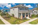 Side view of a two-story home with a well-maintained lawn and landscaping at 13864 Sachs Ave, Orlando, FL 32827