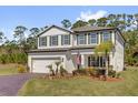 Inviting two-story home featuring well-manicured front yard, a two car garage, and a beautiful green lawn at 3916 Clipstone Pl, Sanford, FL 32773